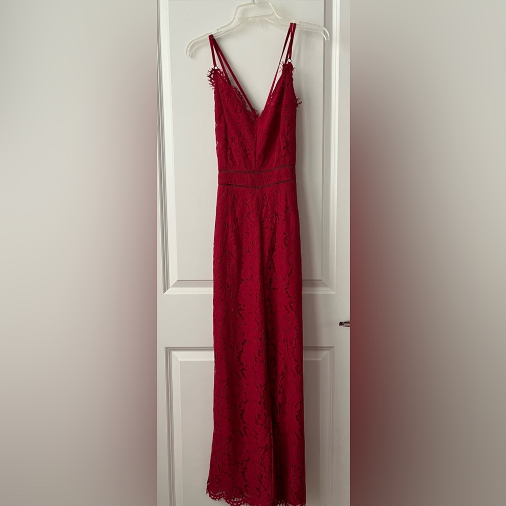 Lady jumpsuit. Criss cross straps.   Scarlet red